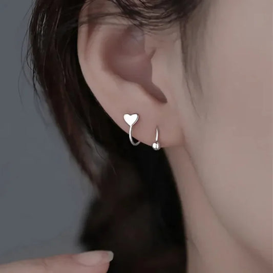 ROTATING LINE HEART EARRINGS